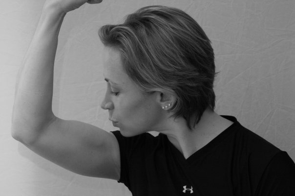 An oldie but a goodie - I am in profile, with short hair, kissing a well-defined bicep. My favorite head shot ever!