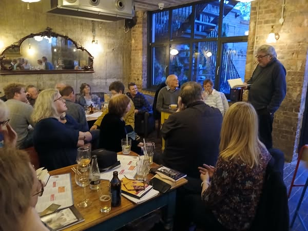 A poet reads his poem from This Here, This Now, at the Claro Lounge launch of the anthology